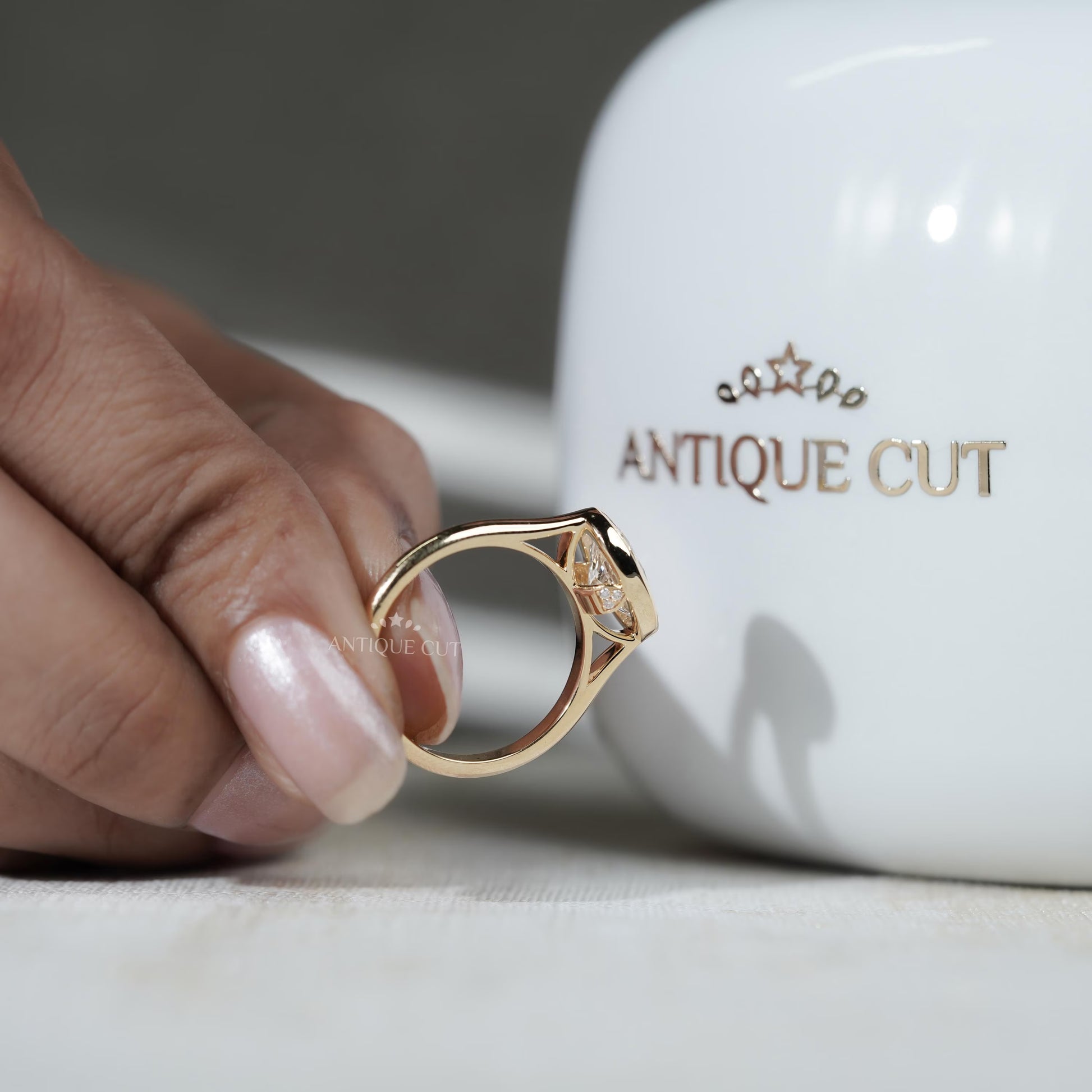 Gold ring with a diamond on a hand
