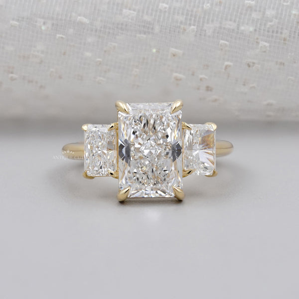 Three stone diamond ring with side stone detail