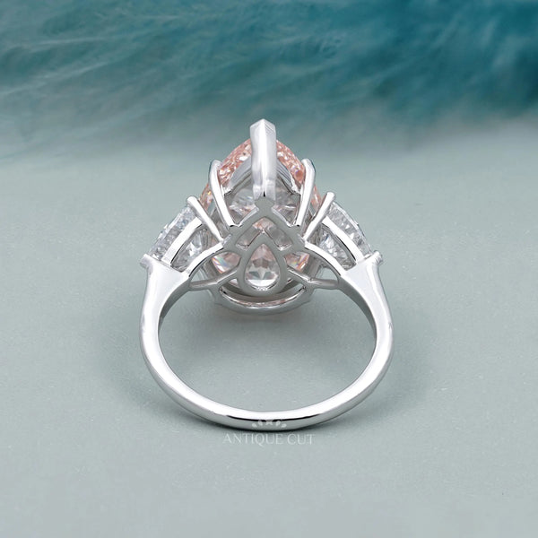Fancy Pink Pear Ring With Trillion Side Stone