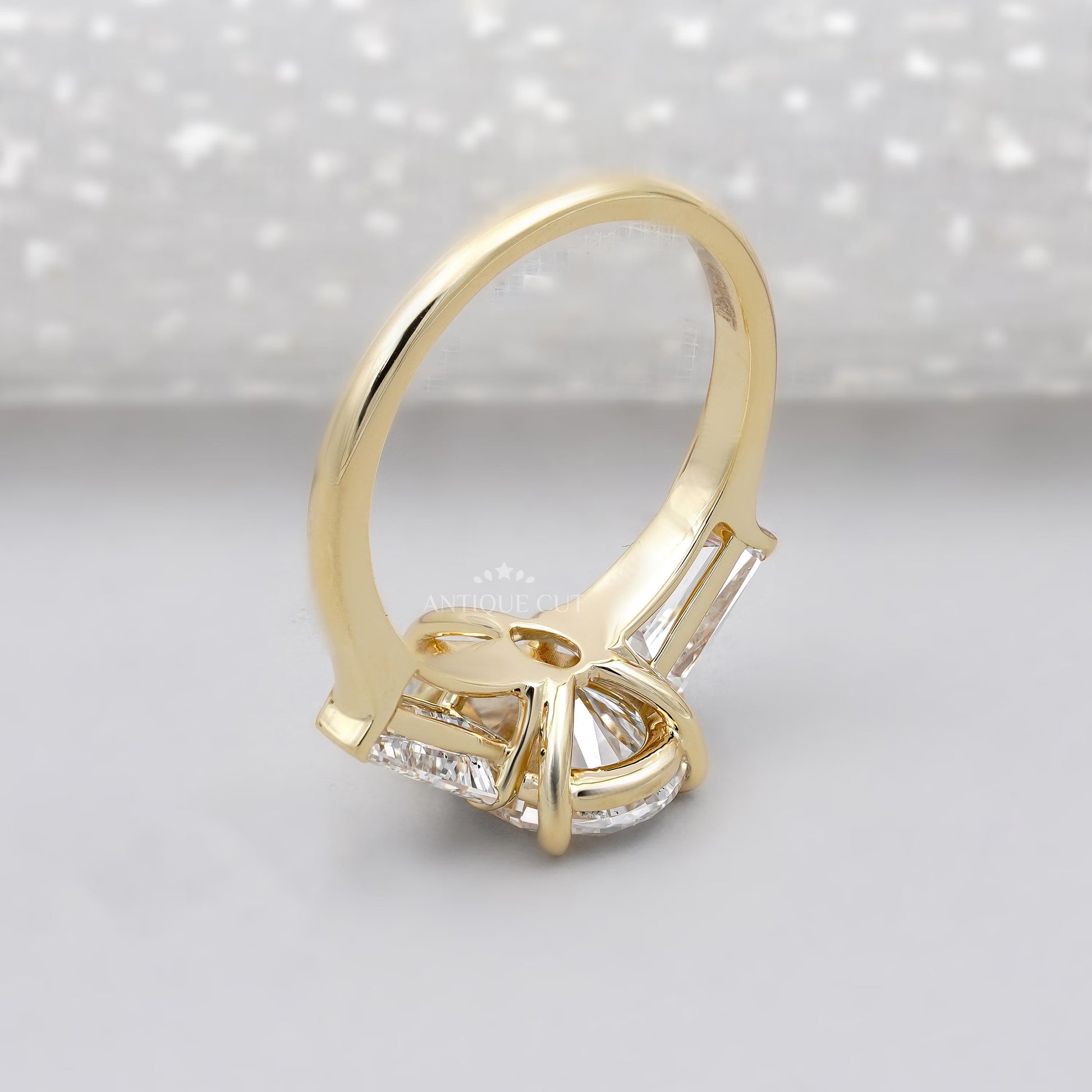 Antiquecut three stone pear engagement ring