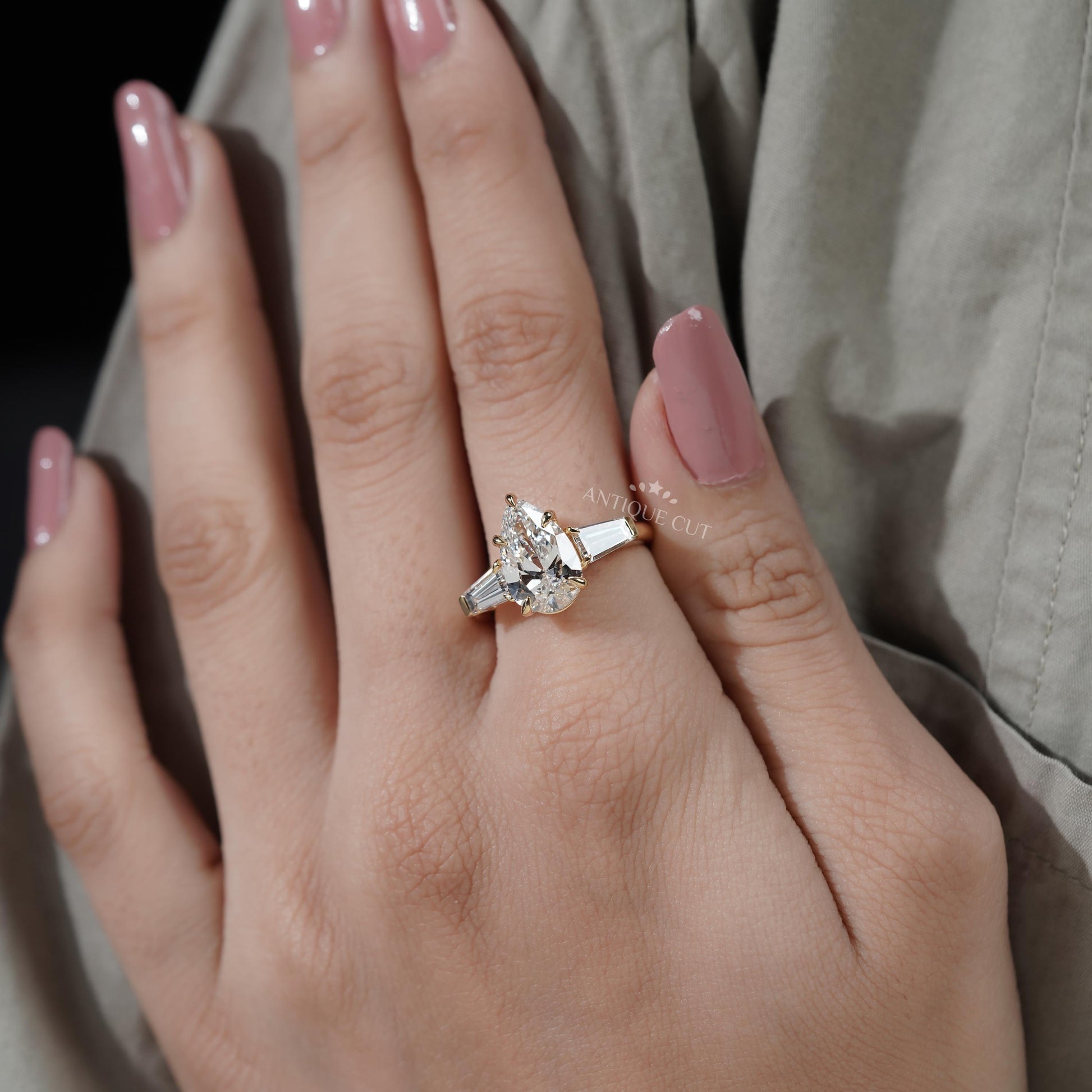 Classic three stone pear diamond engagement ring