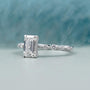Emerald cut diamond ring with side stones
