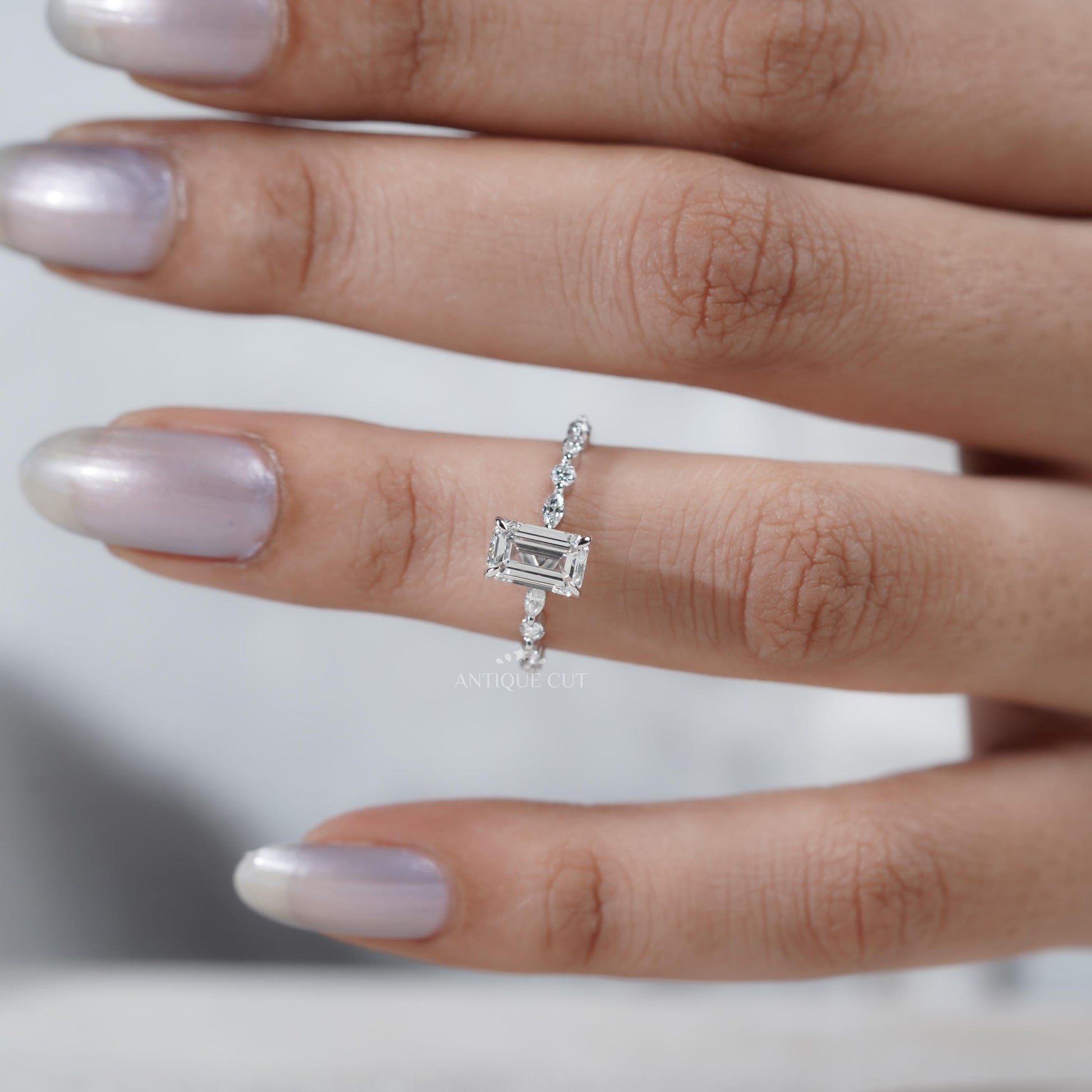 Emerald cut diamond ring side view
