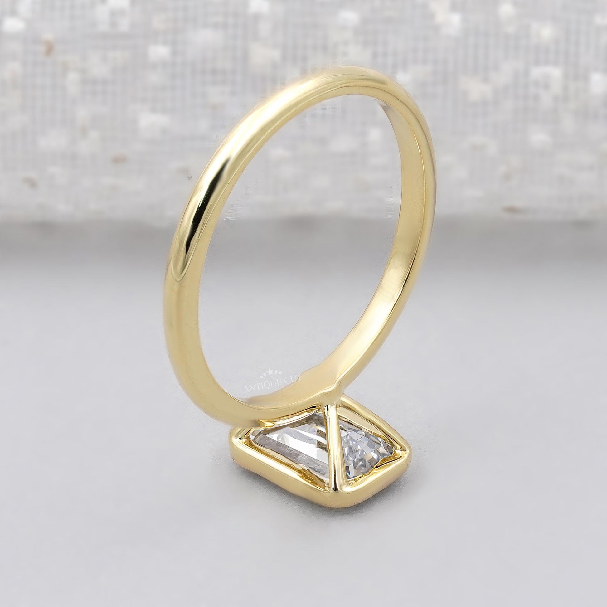 Minimalist emerald solitaire diamond ring