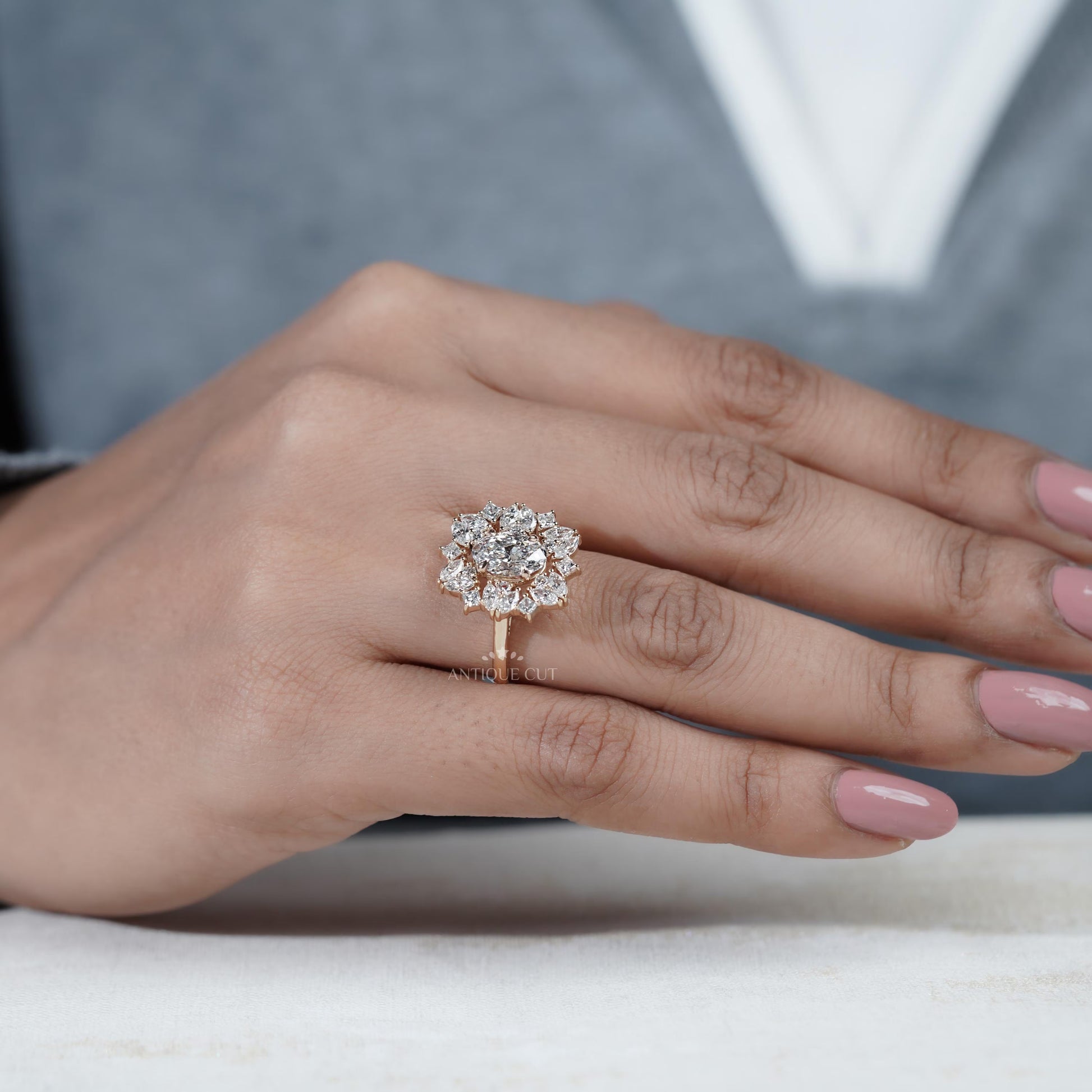 Close-up of a hand wearing a rose gold diamond ring on a Nautral background


