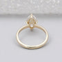 Gold ring with a marquise-shaped diamond