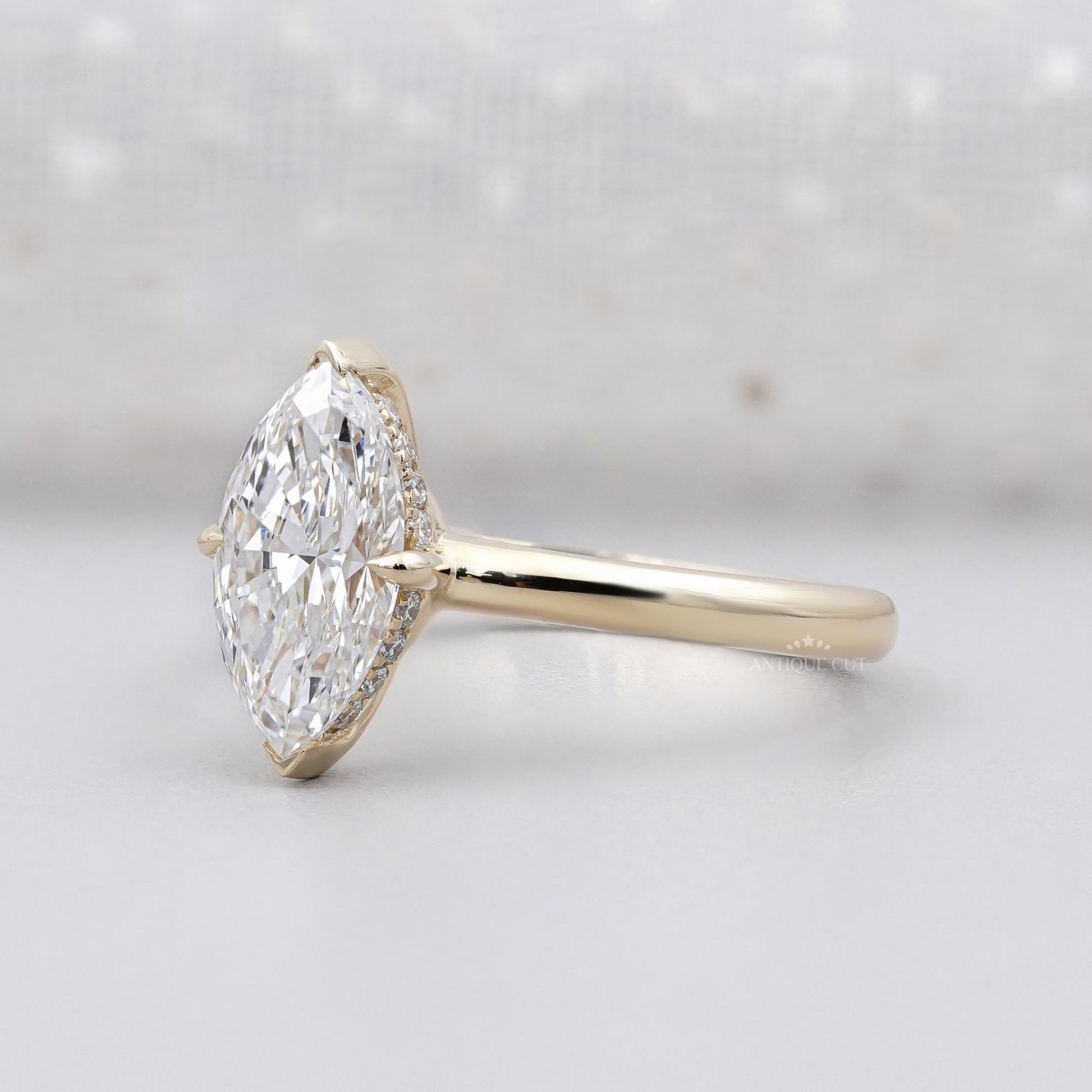 Gold ring with a marquise-shaped diamond