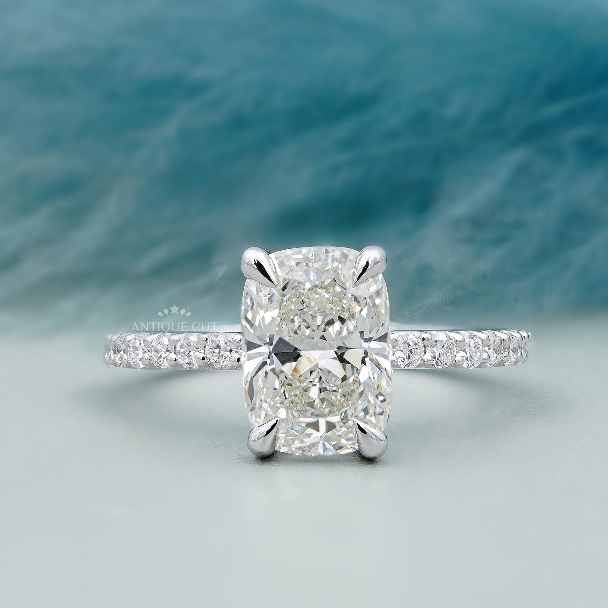 Cushion cut pave engagement ring in white gold