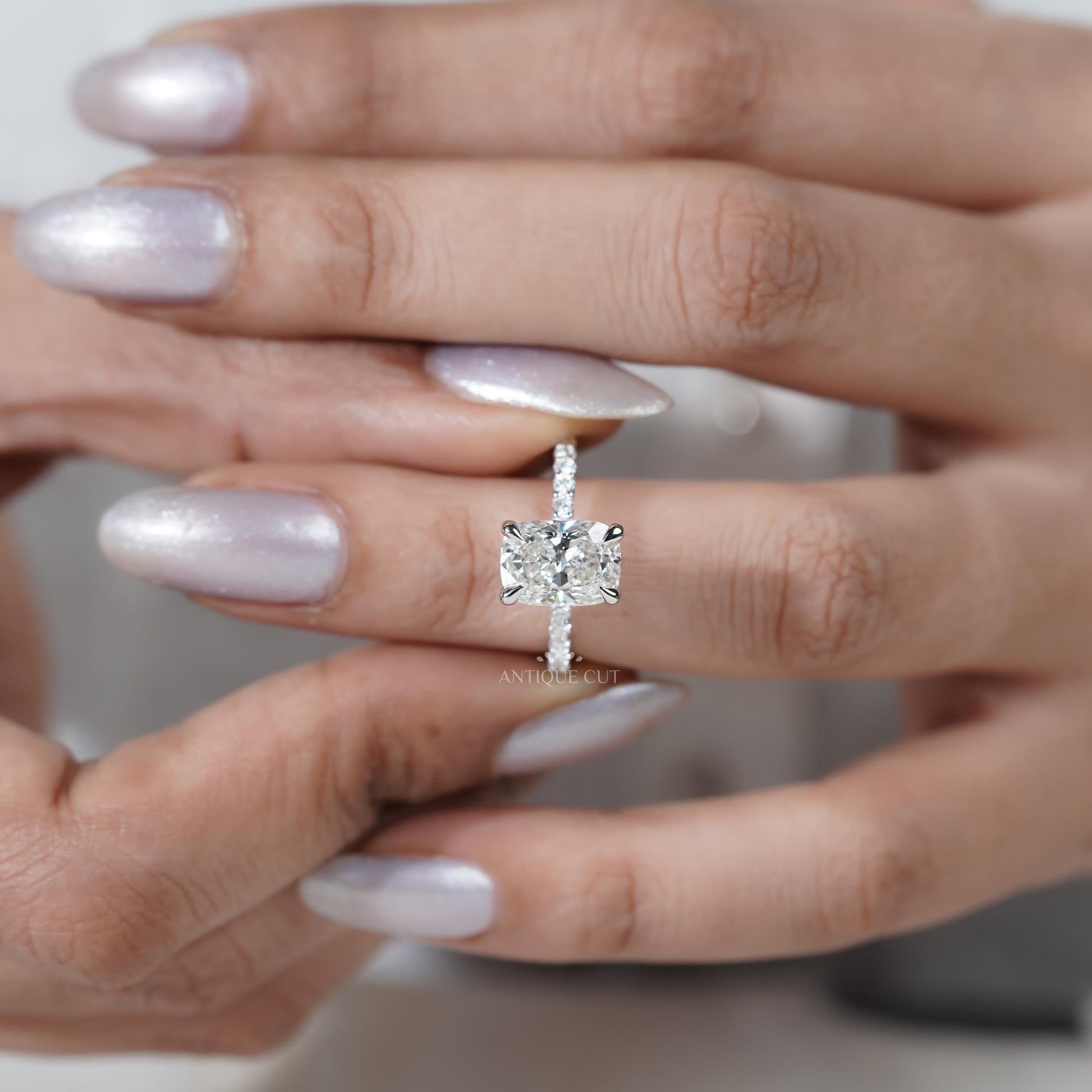 Cushion diamond ring side view with pave band