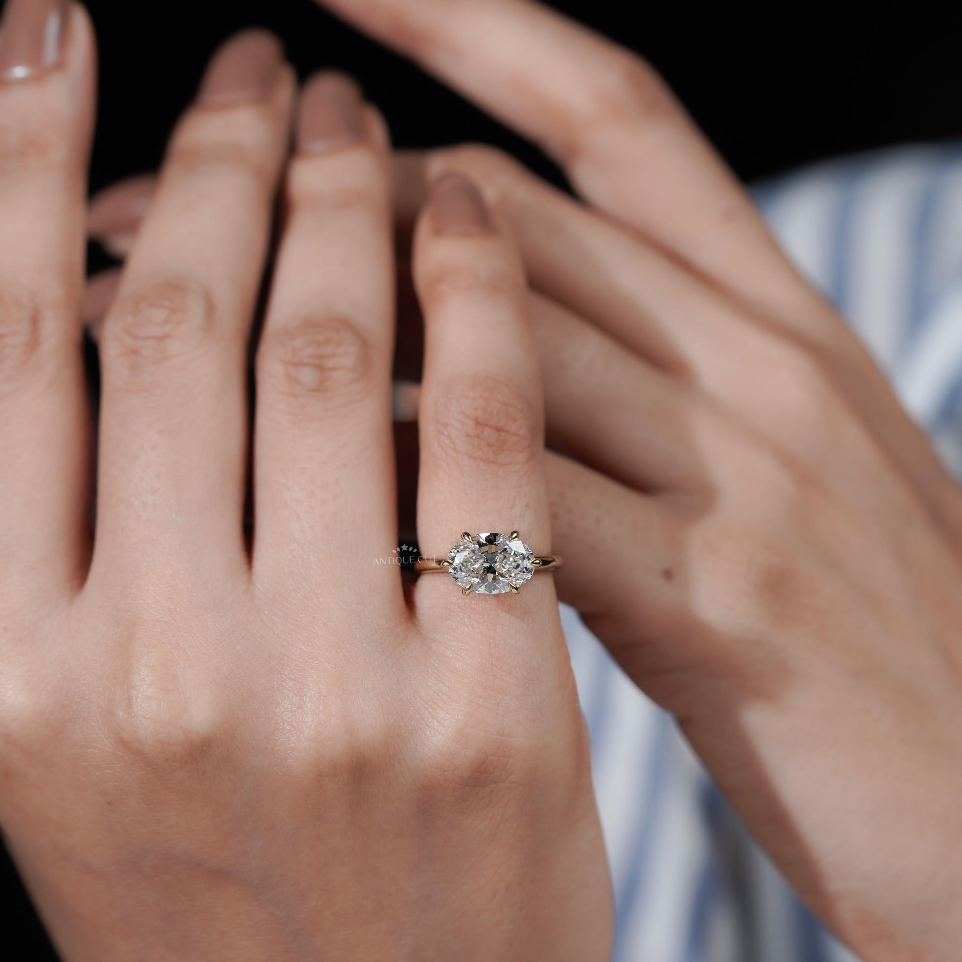 East West oval engagement ring with solitaire diamond