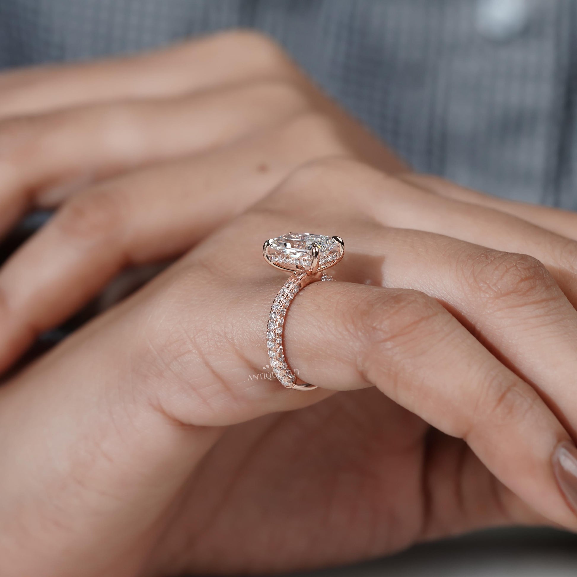 Diamond ring held by a hand 