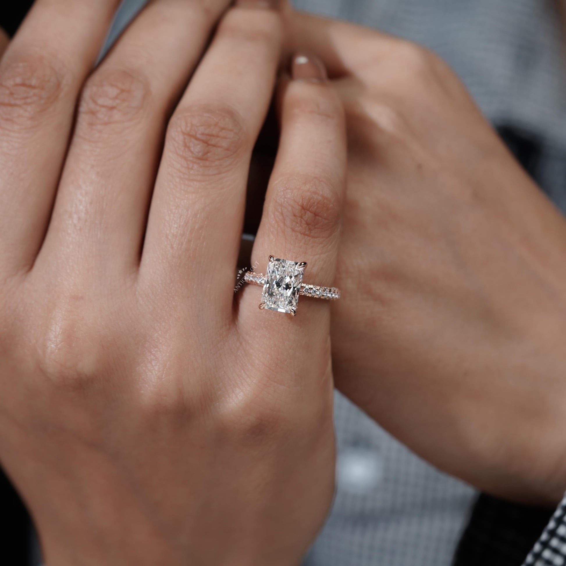 Diamond ring held by a hand 