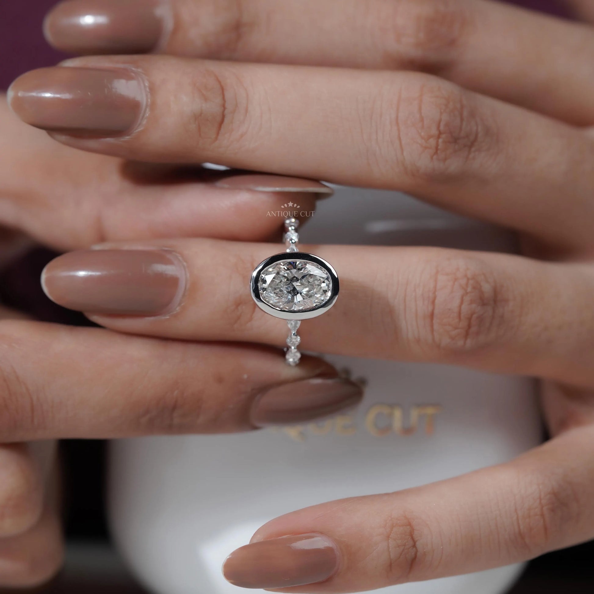 Silver ring with a diamond on a hand

