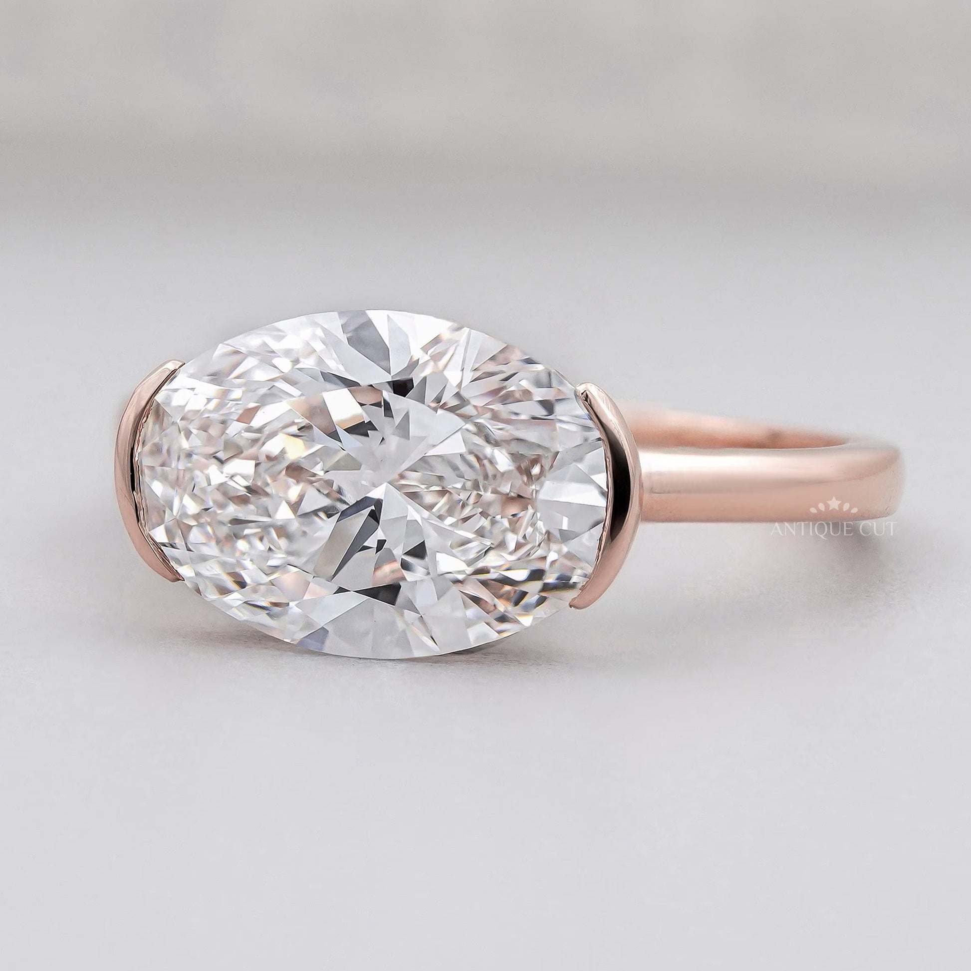 Lab grown oval diamond east west solitaire ring