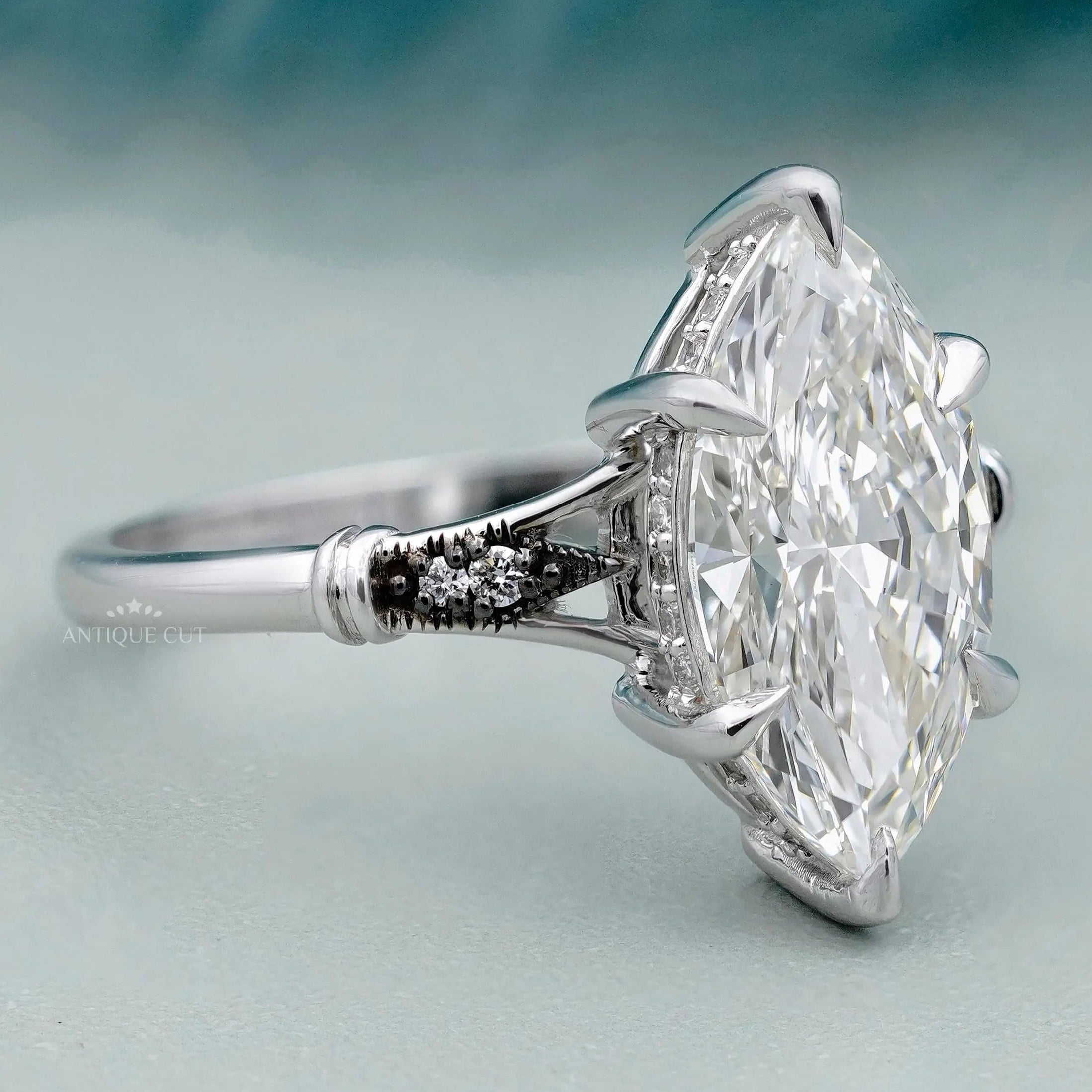 Vintage marquise engagement ring with hidden halo