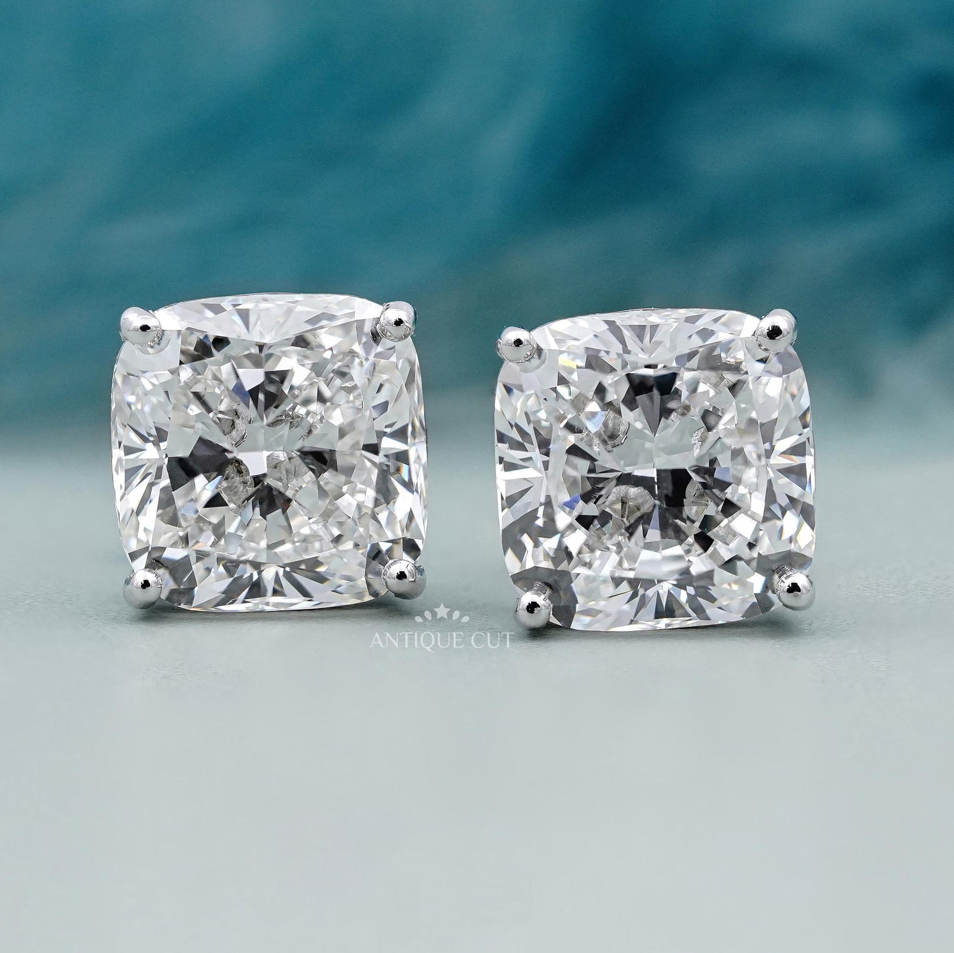 Cushion cut diamond stud earrings with classic setting