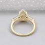 Elegant pear diamond engagement ring with tapered side stones