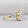 Lab grown pear three stone engagement ring