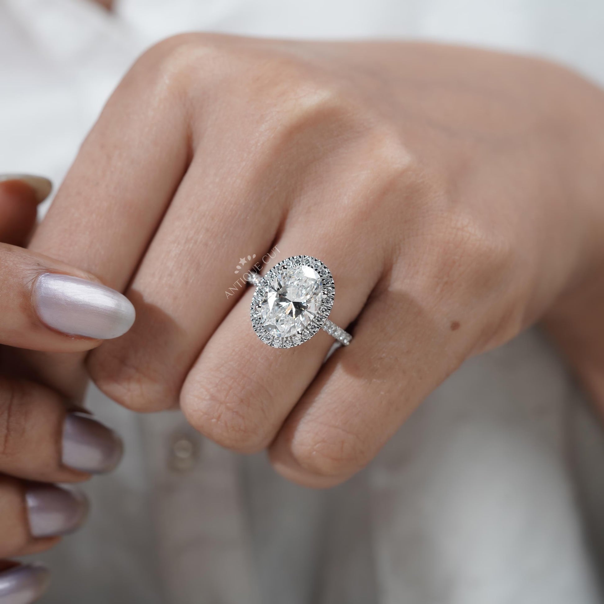 Oval Halo Engagement Ring in White Gold with Pave Diamond Band - IGI Certified