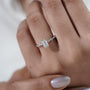 Luxury emerald cut engagement ring with side stones
