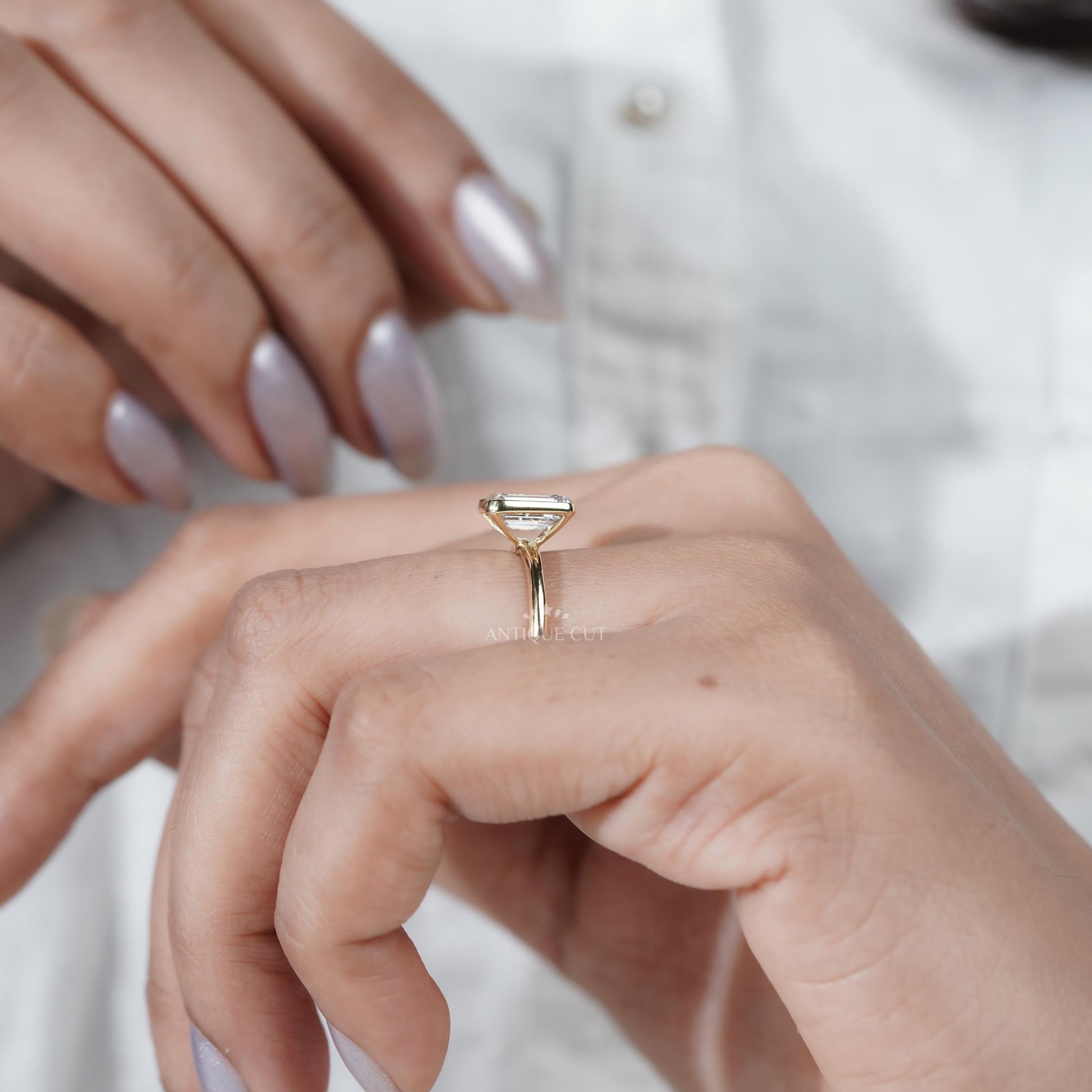 Luxury yellow gold emerald solitaire diamond ring
