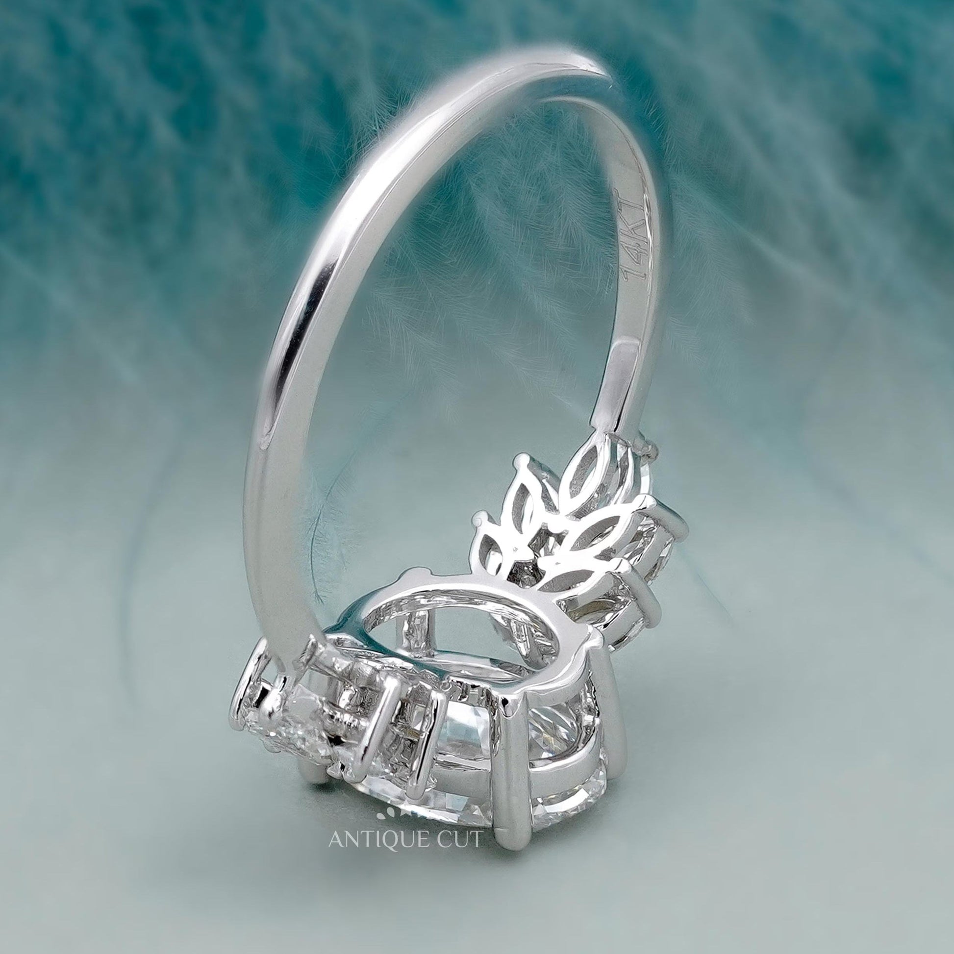 IGI certified oval diamond ring with marquise diamonds