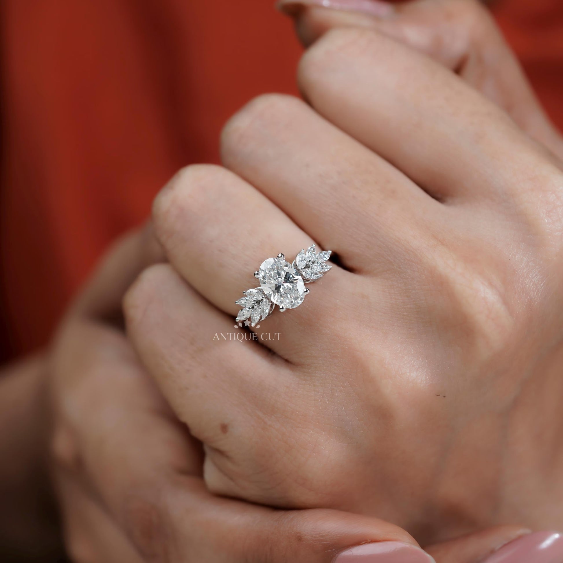 Diamond ring on a finger with 'AntiqueCut' text