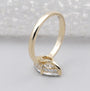 Gold ring with a marquise-shaped diamond