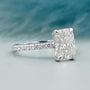 Diamond ring with a blue and gray gradient background


