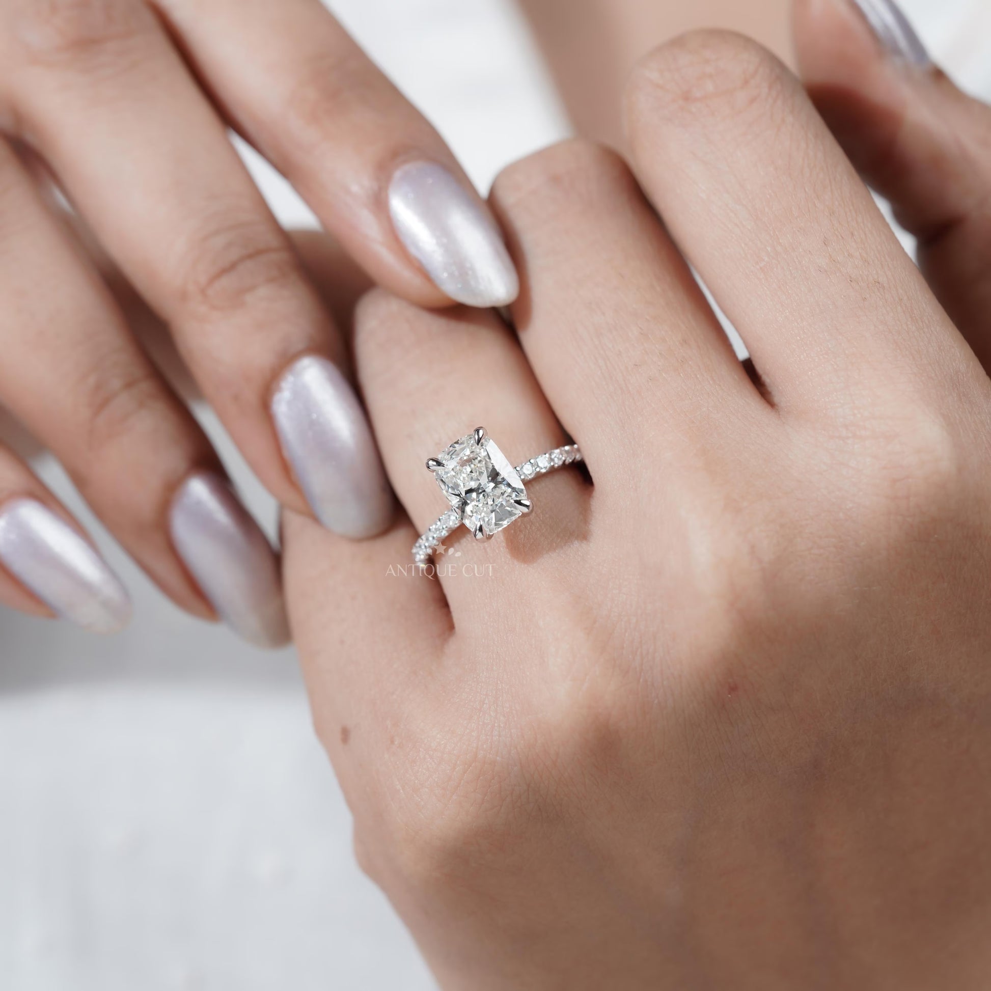 White gold cushion diamond ring close-up
