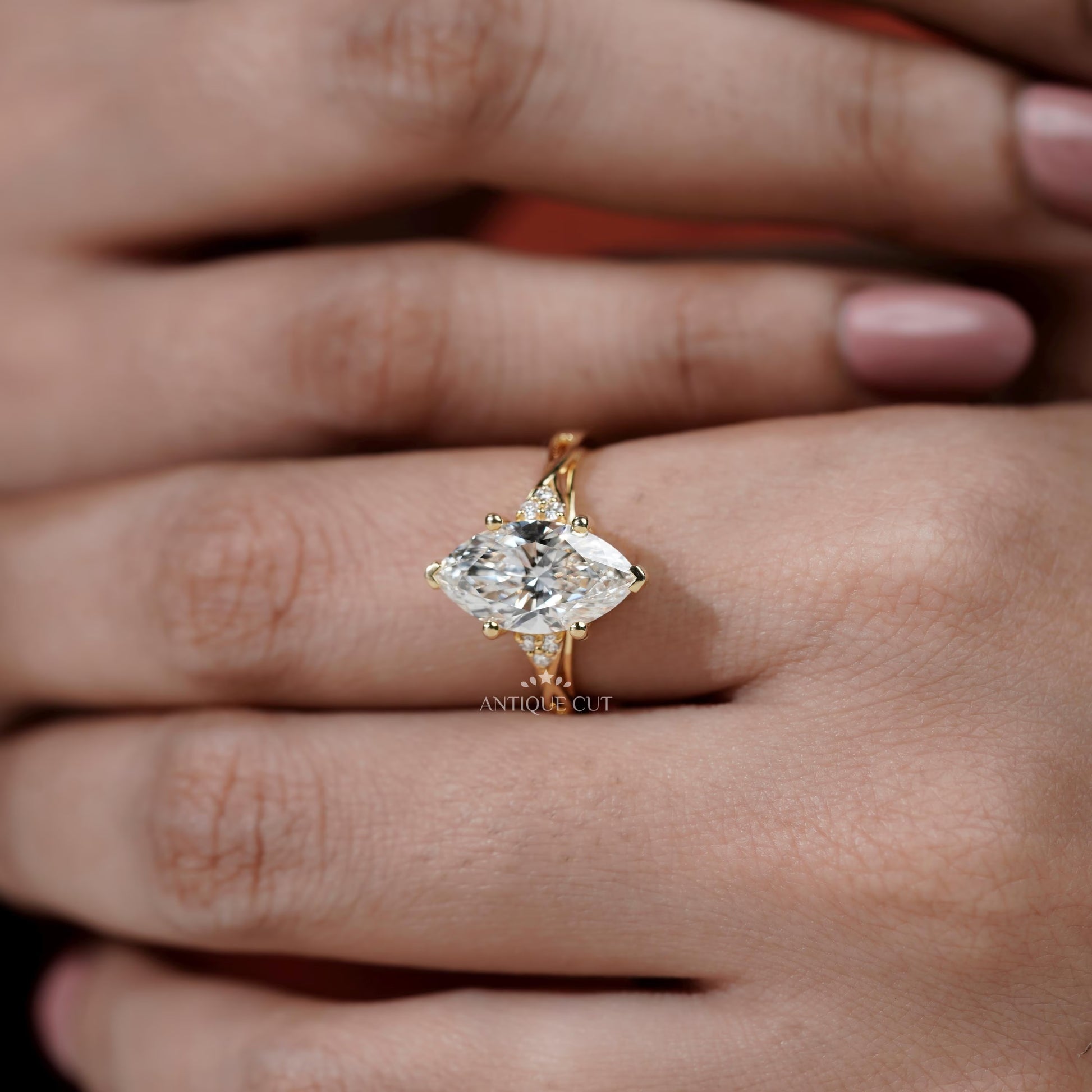 Gold ring with a large diamond on a hand