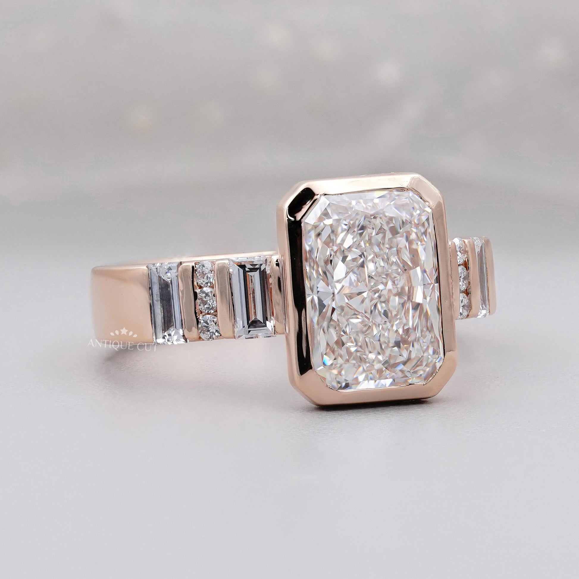 Round and baguette side stone engagement ring 