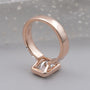 Bezel set diamond ring with radiant cut diamond