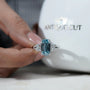 Cushion blue diamond ring with double prong platinum setting