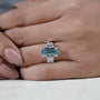 Cushion cut blue diamond solitaire ring with double prong details