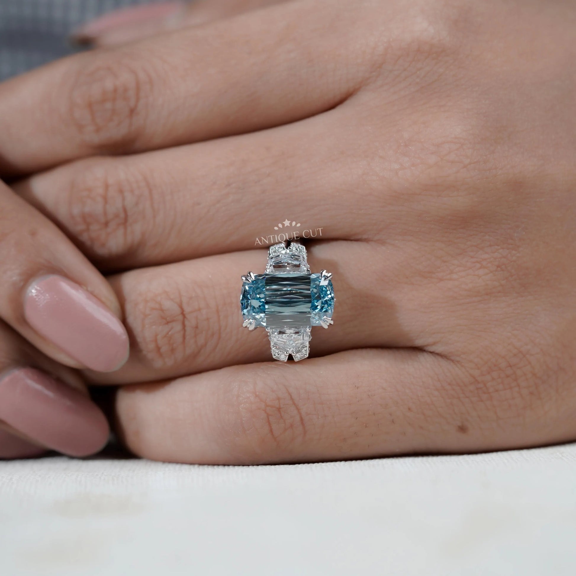 Cushion cut blue diamond solitaire ring with double prong details