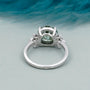 Lab grown round green diamond ring with marquise sides