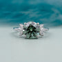 Round cut antique green diamond ring marquise side stones