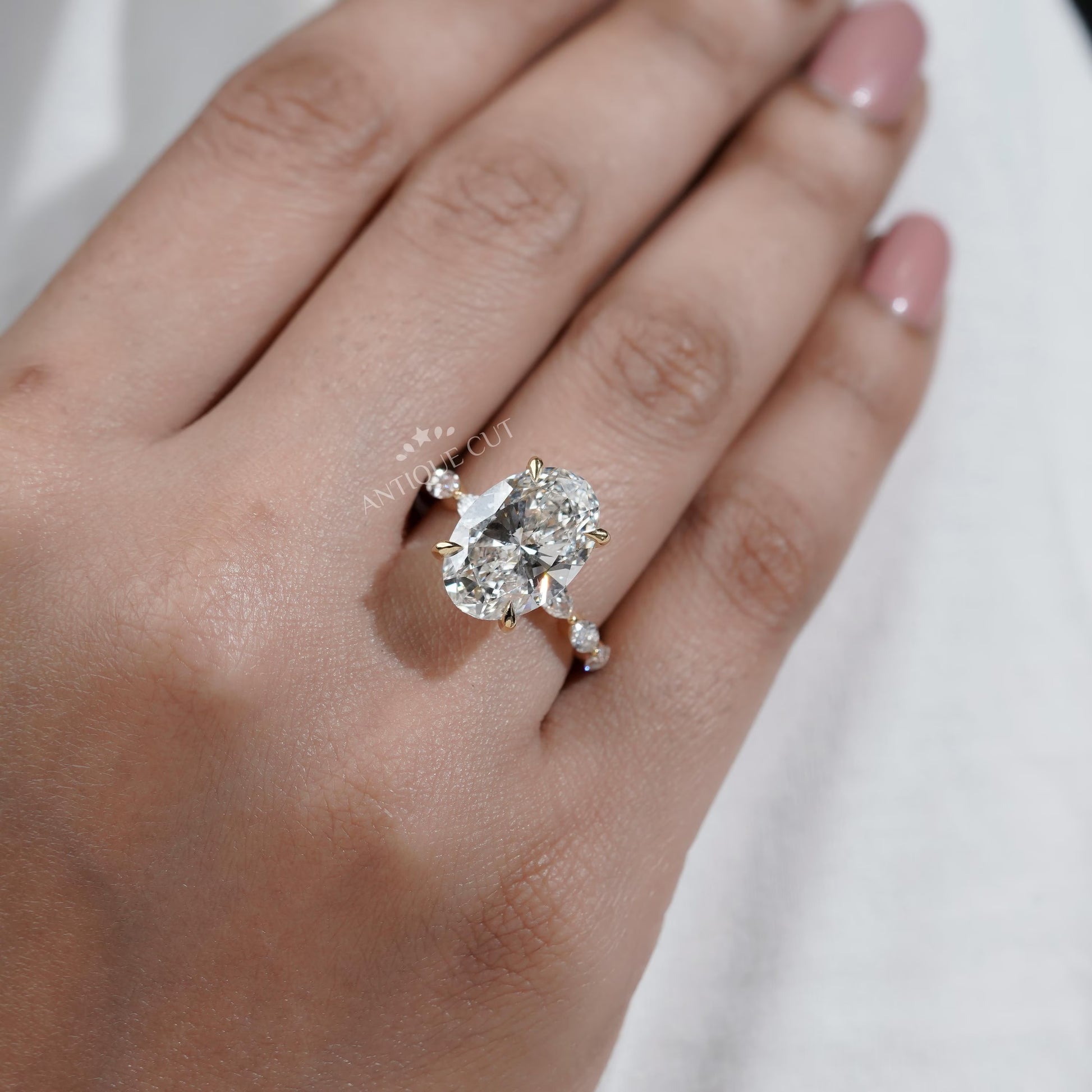 Oval Cut Diamond Engagement Ring with Hidden Halo & Marquise Side Stones