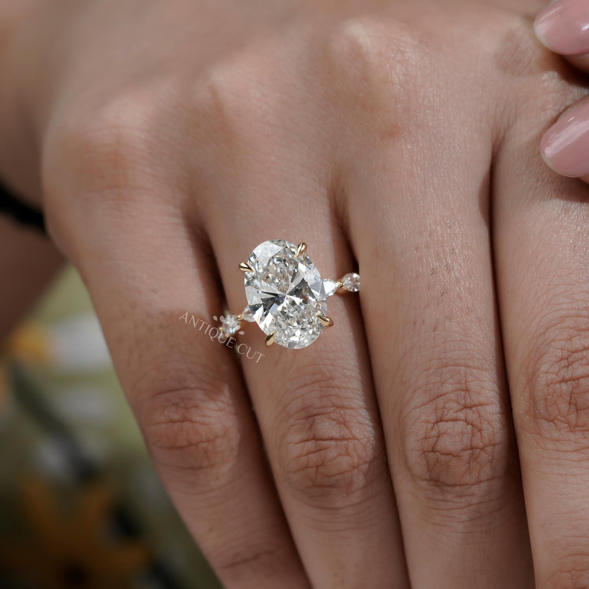 Oval Cut Diamond Engagement Ring with Hidden Halo & Marquise Side Stones
