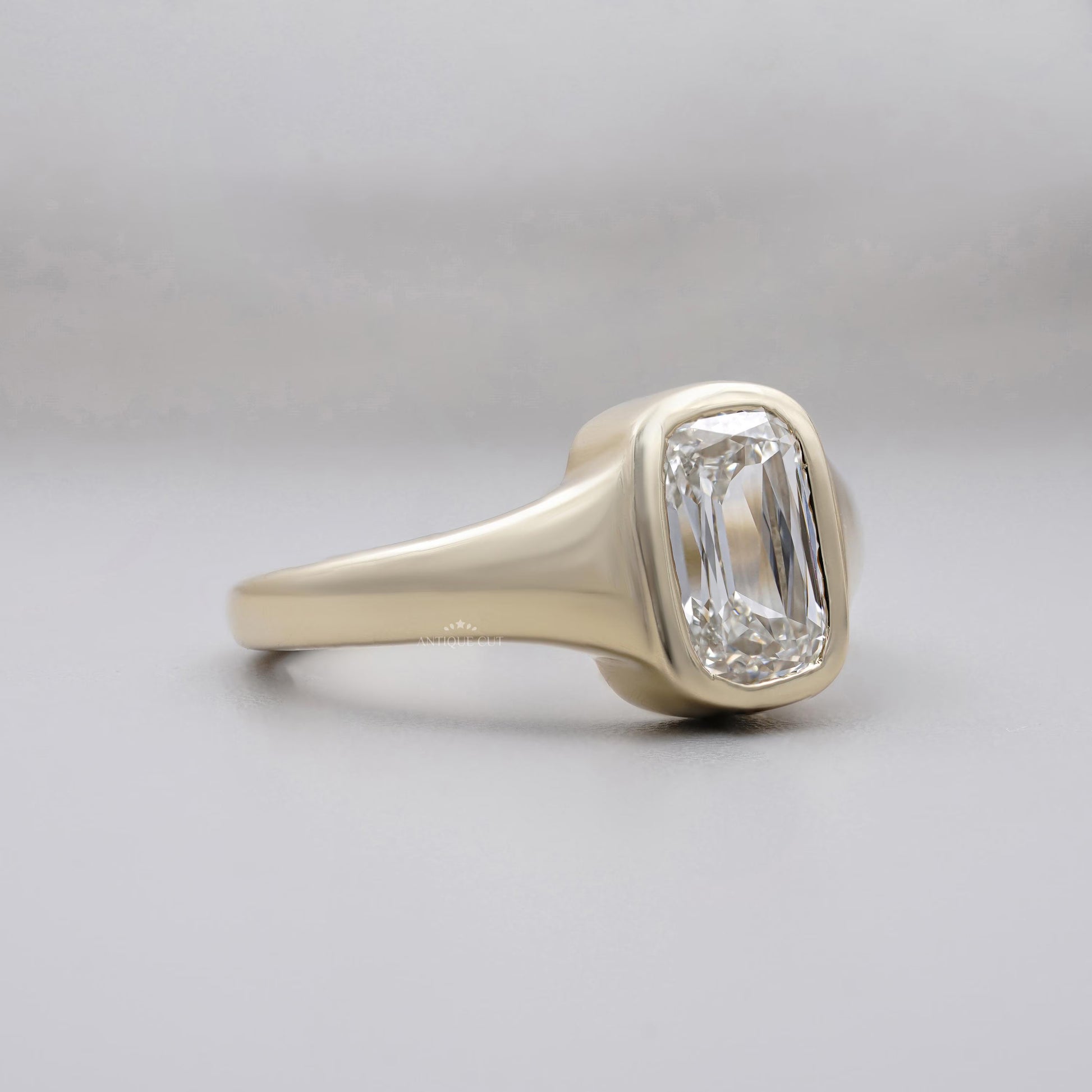 Bezel set elongated cushion diamond ring IGI certified