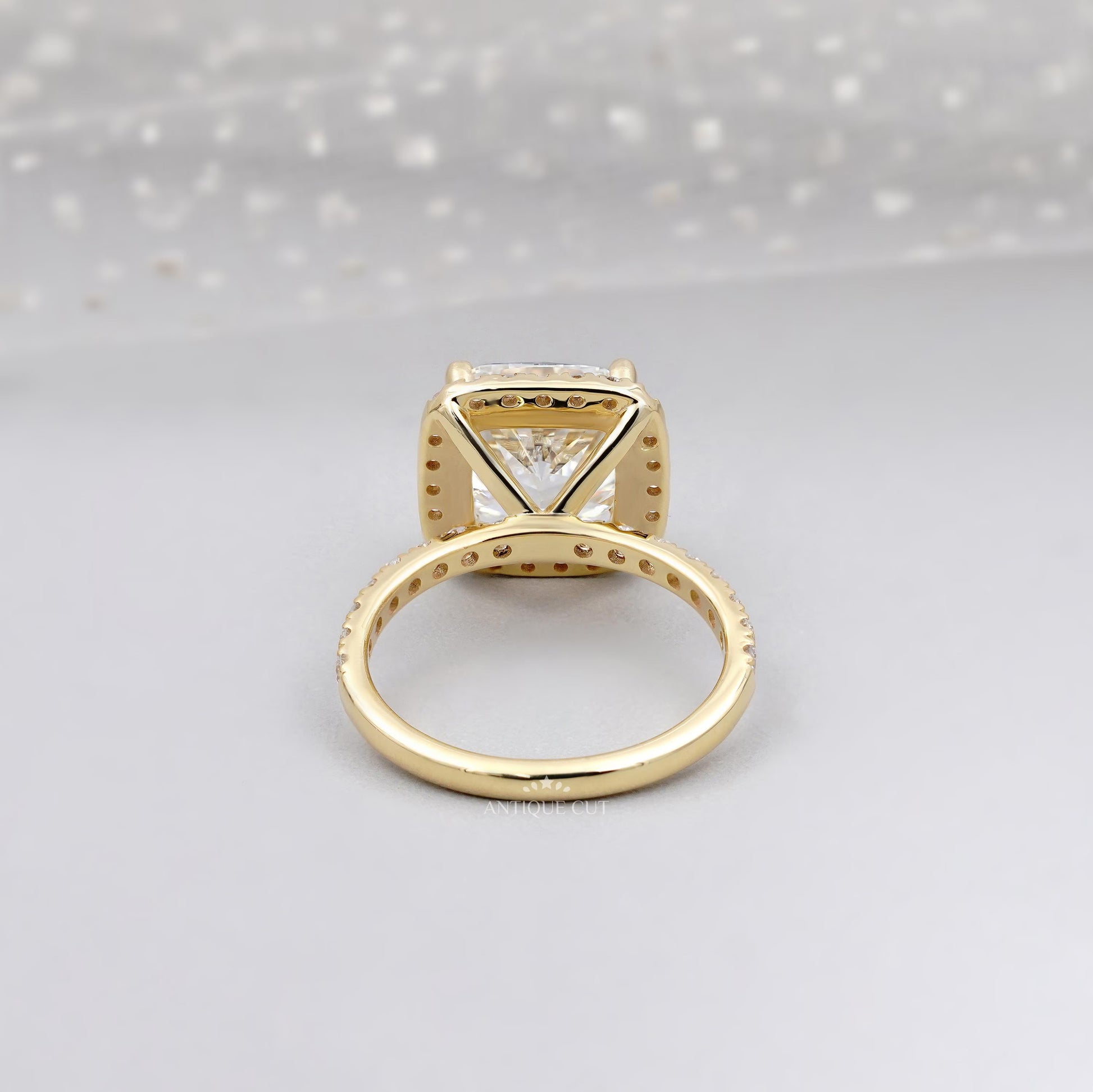 Cushion cut diamond ring with halo and pave band