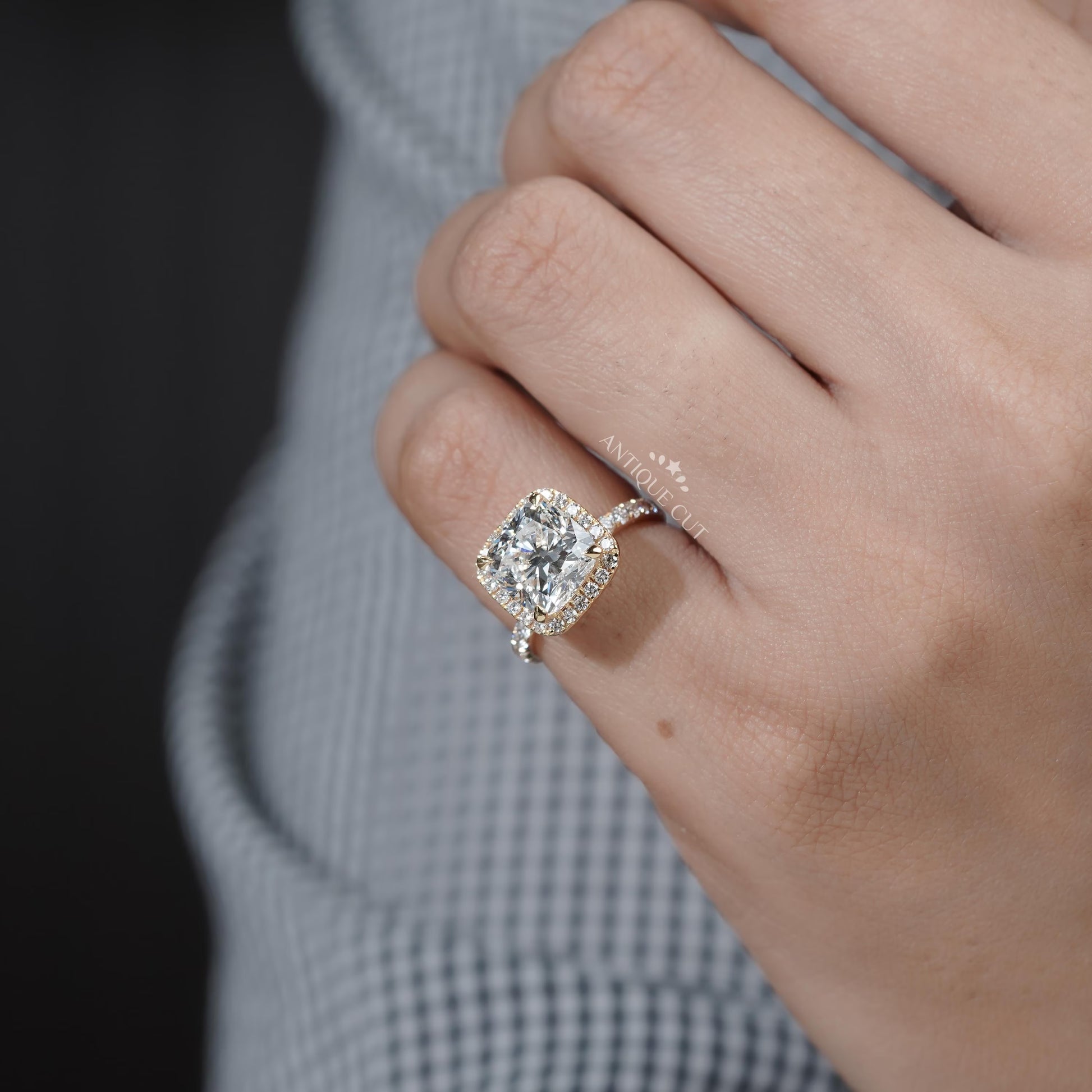 Yellow gold cushion diamond engagement ring close-up