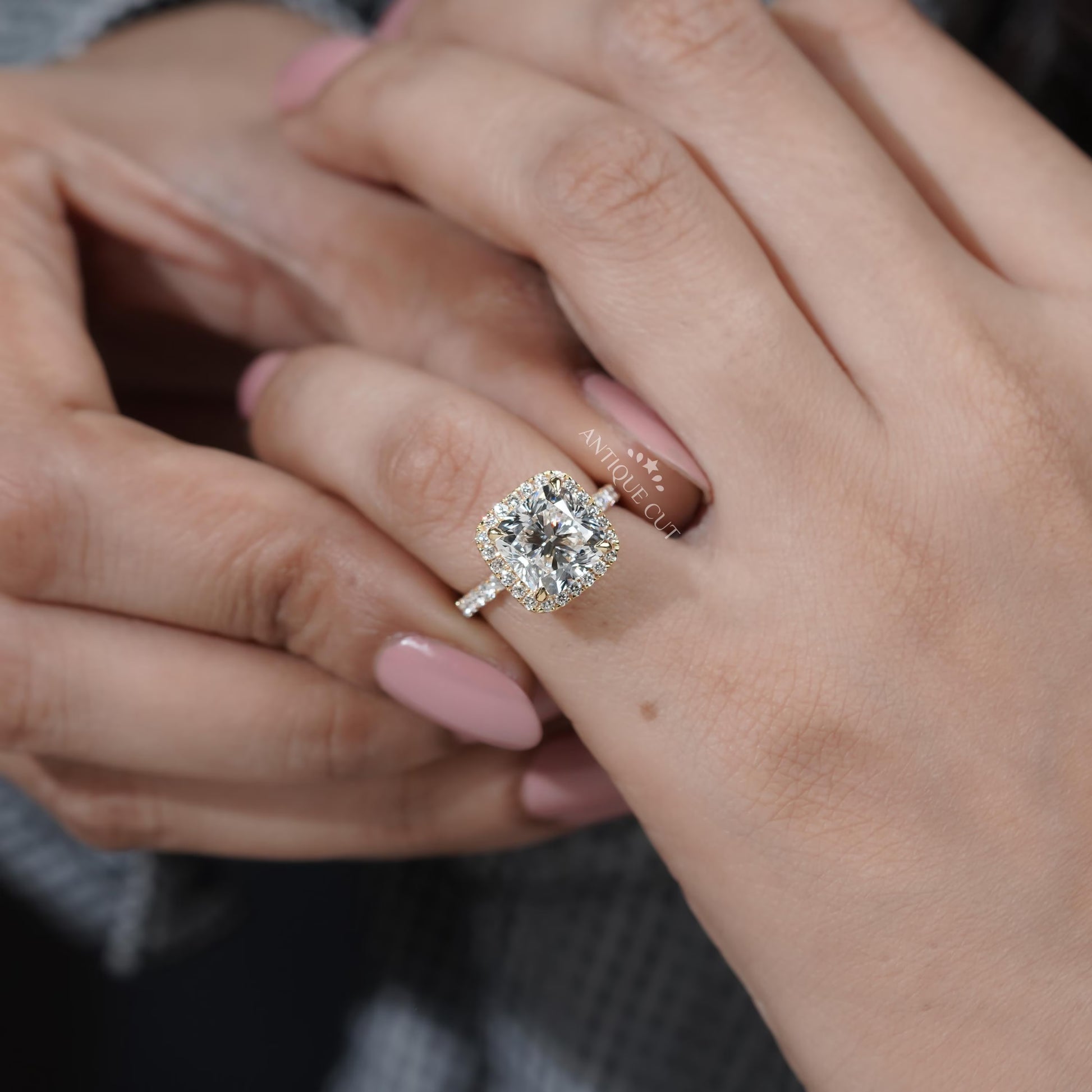 Yellow gold cushion cut diamond halo ring detailed view