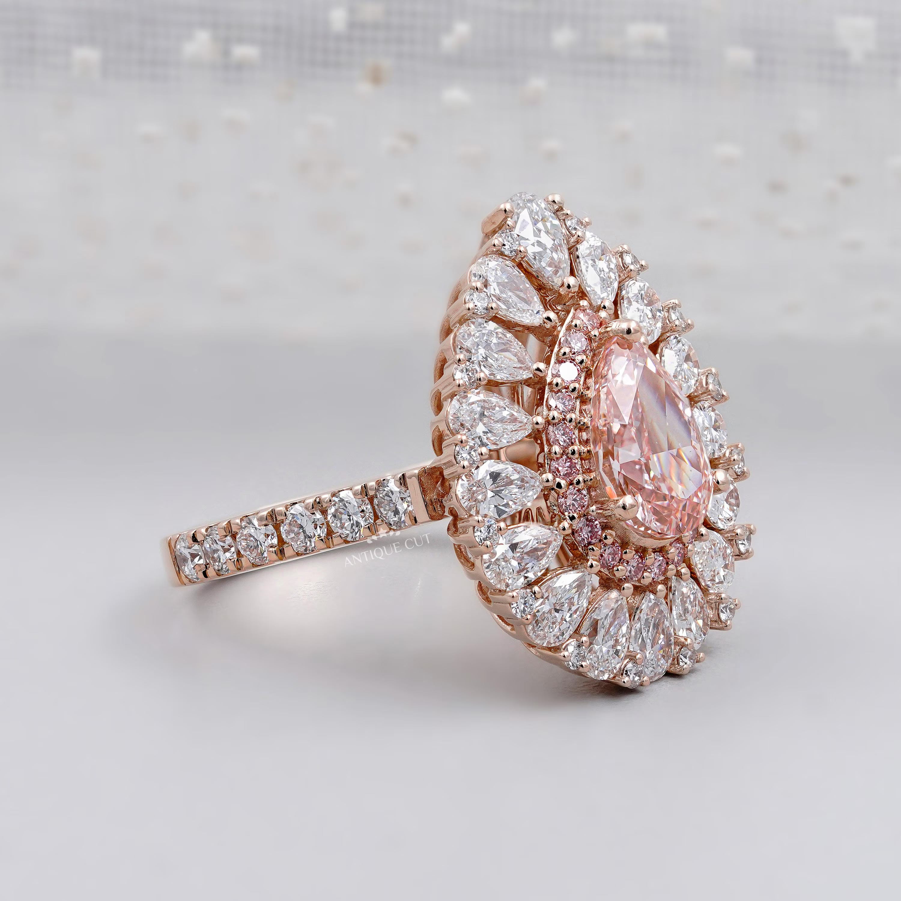 Teardrop halo ring with sparkling diamonds