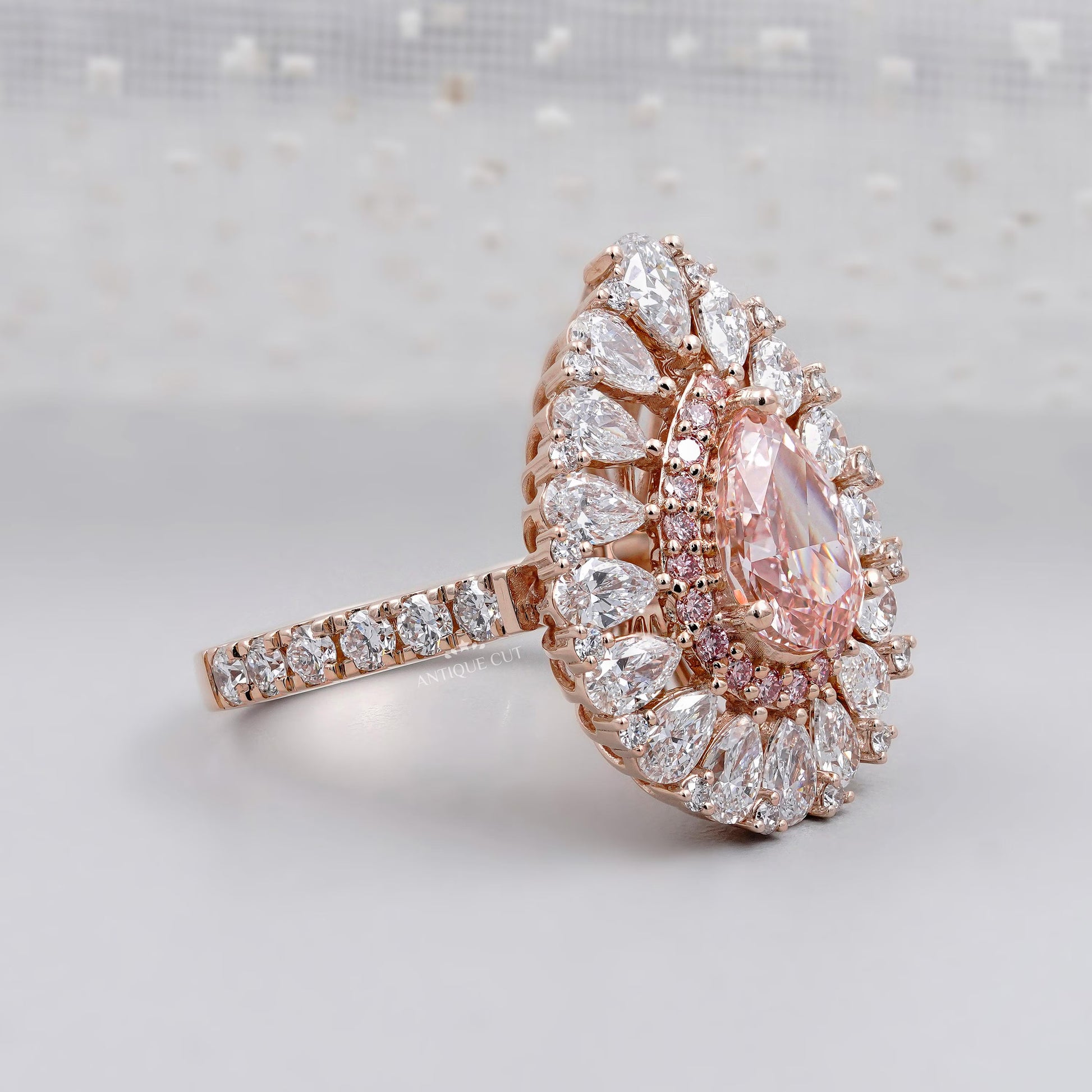 Teardrop halo ring with sparkling diamonds