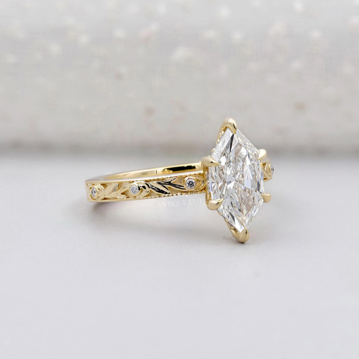 Hexagon cut diamond engagement ring with vintage inspired design
