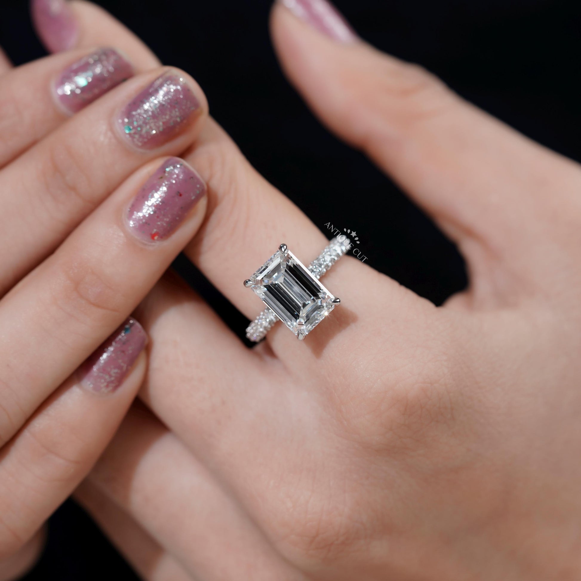 Emerald cut hidden halo engagement ring 