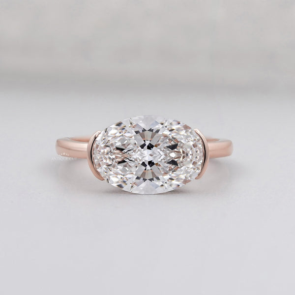 Pear side stone engagement ring