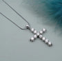 Elegant gold cross pendant with sparkling diamond setting